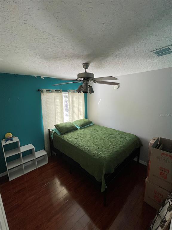 879 Little Bend Road Altamonte Springs, FL 32714 - Photo 15 of 23 a bedroom with a bed and window