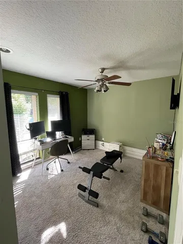 a workspace with furniture and window