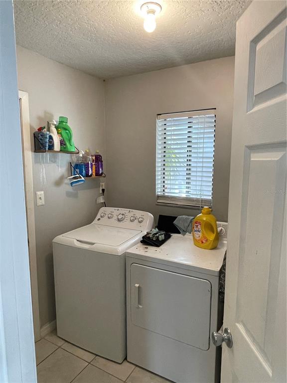 879 Little Bend Road Altamonte Springs, FL 32714 - Photo 19 of 23 a utility room with dryer and washer