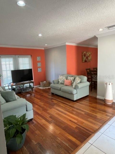879 Little Bend Road Altamonte Springs, FL 32714 - Photo 6 of 23 a living room with furniture and a flat screen tv