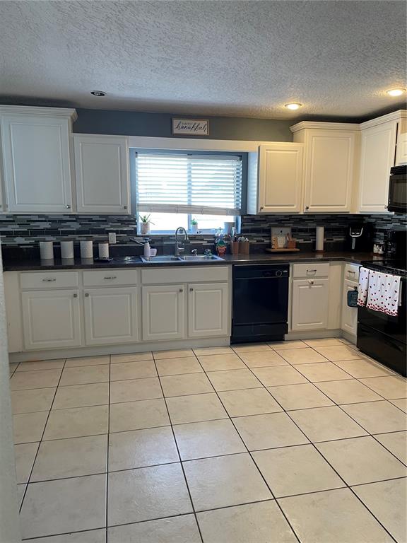 879 Little Bend Road Altamonte Springs, FL 32714 - Photo 9 of 23 a large kitchen with granite countertop a stove a sink and a microwave