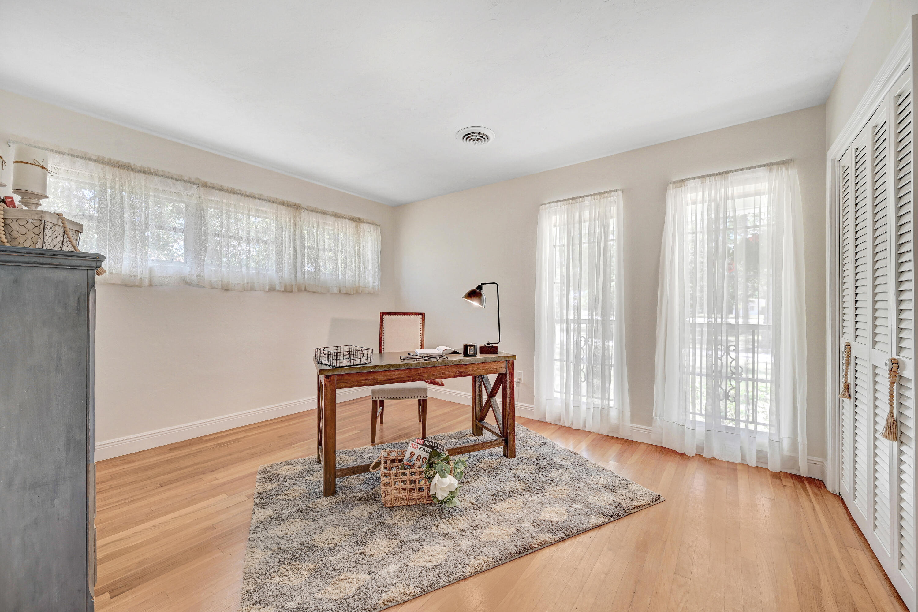 2340 Turtle Mound Road Melbourne, FL 32934 - Photo 18 of 30 a dining room with wooden floor and a window