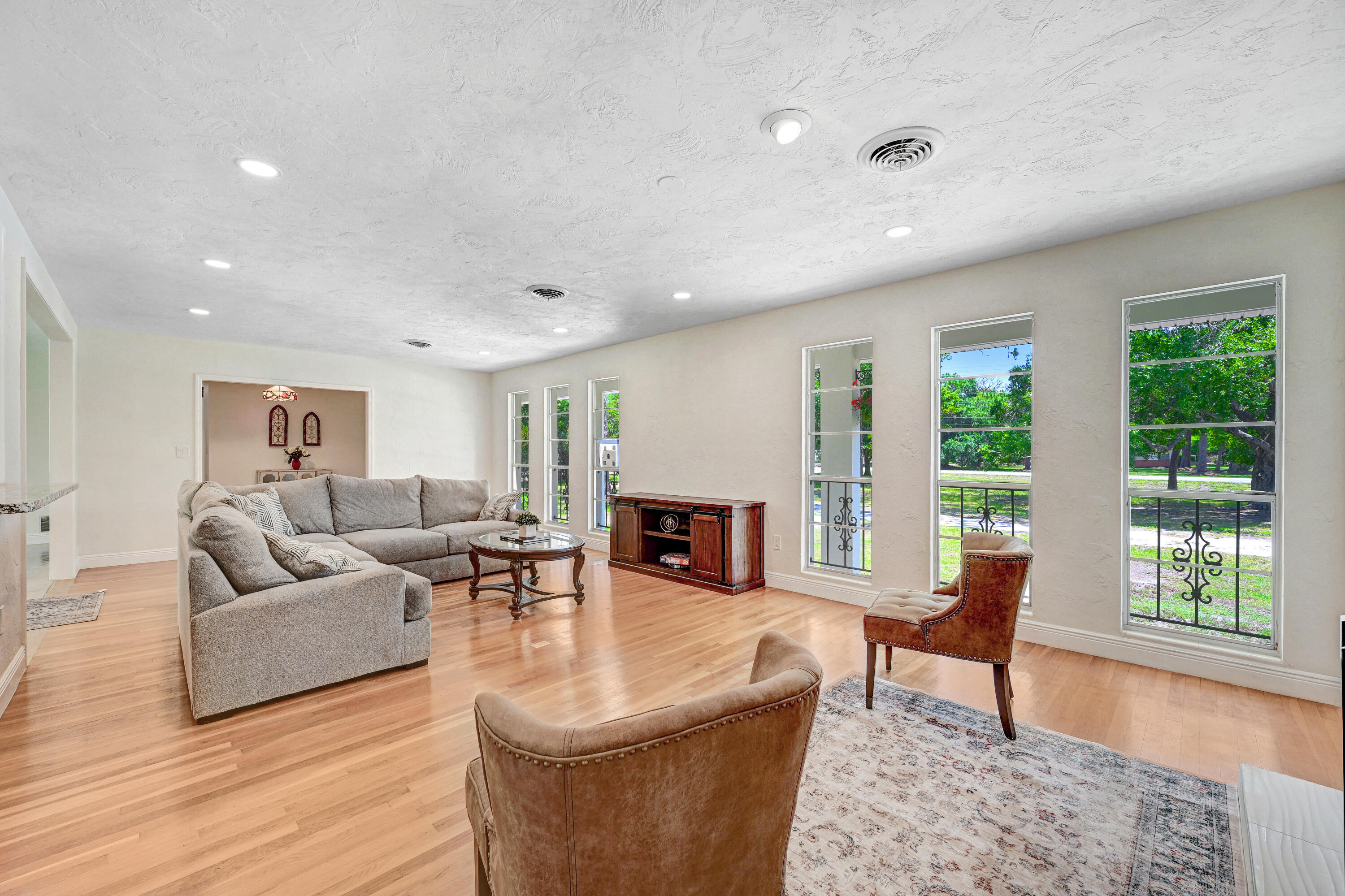 2340 Turtle Mound Road Melbourne, FL 32934 - Photo 4 of 30 a living room with fireplace furniture and a large window