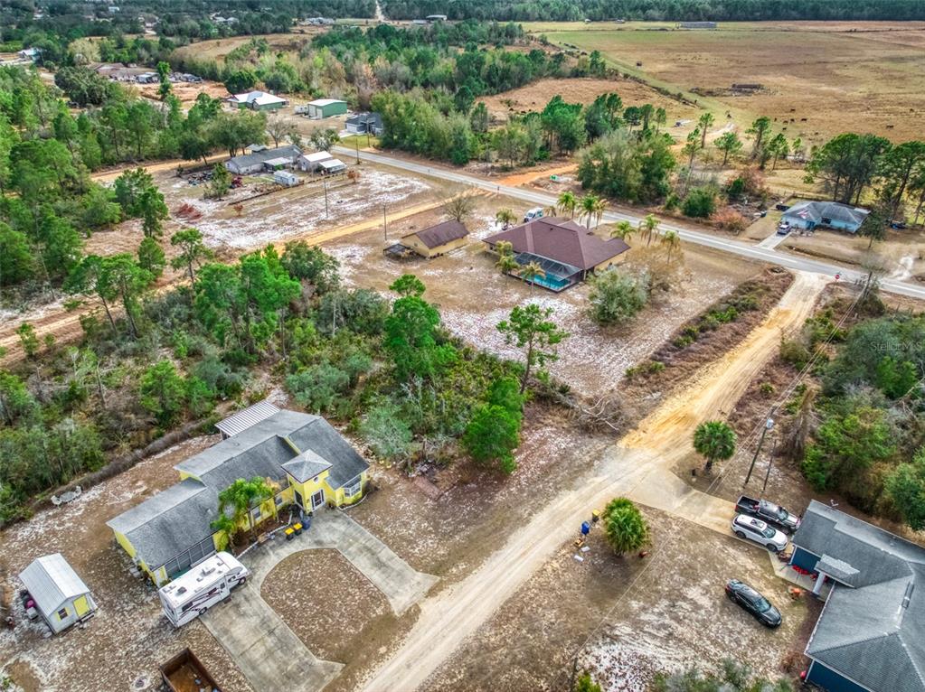 3085 West Scoralick Road Avon Park, FL 33825 - Photo 11 of 16 an aerial view of a house with a yard and lake view