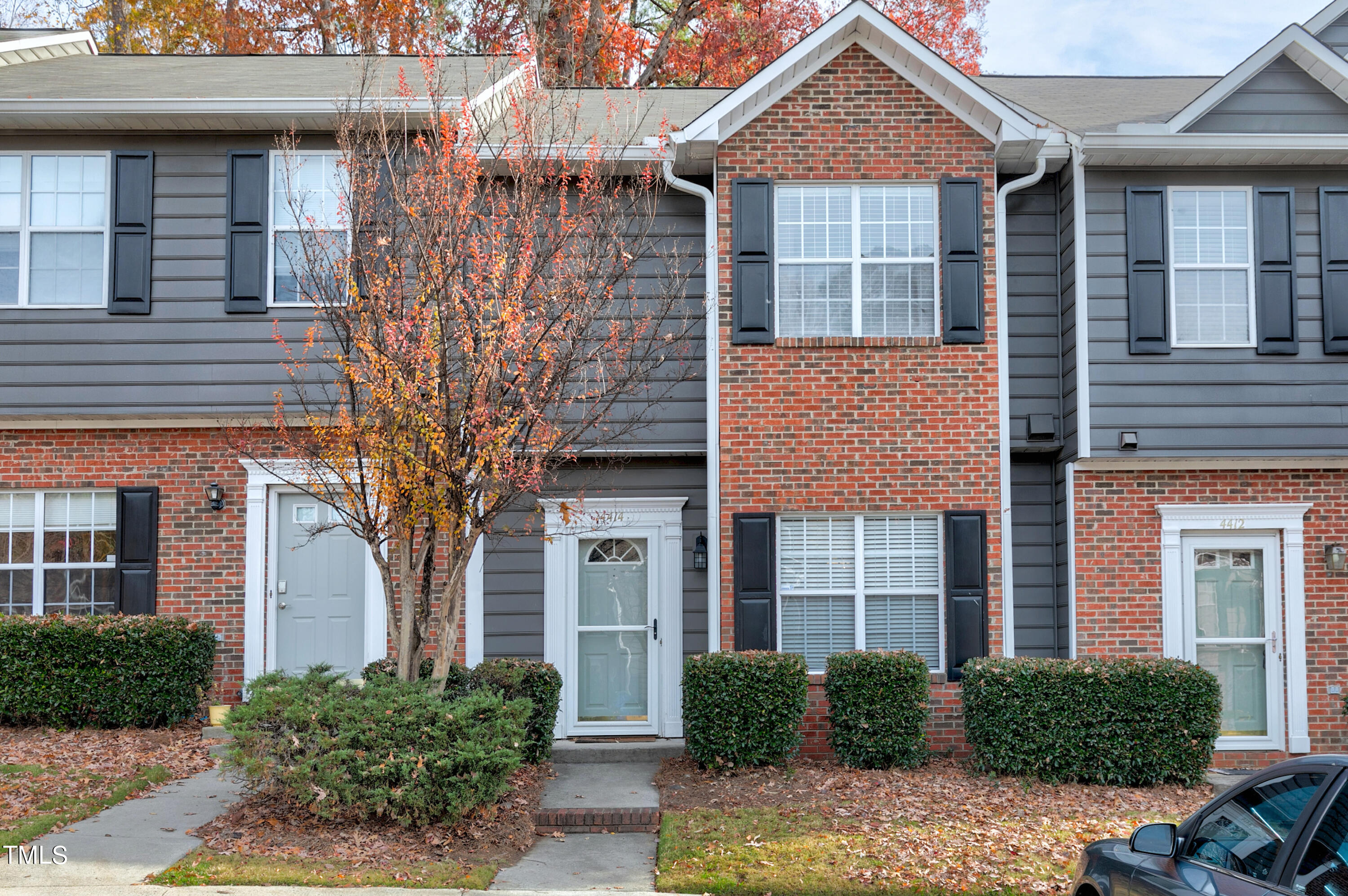 4414 Still Pines Drive Raleigh, NC 27613 - Photo 1 of 36 a front view of a house with a yard and potted plants