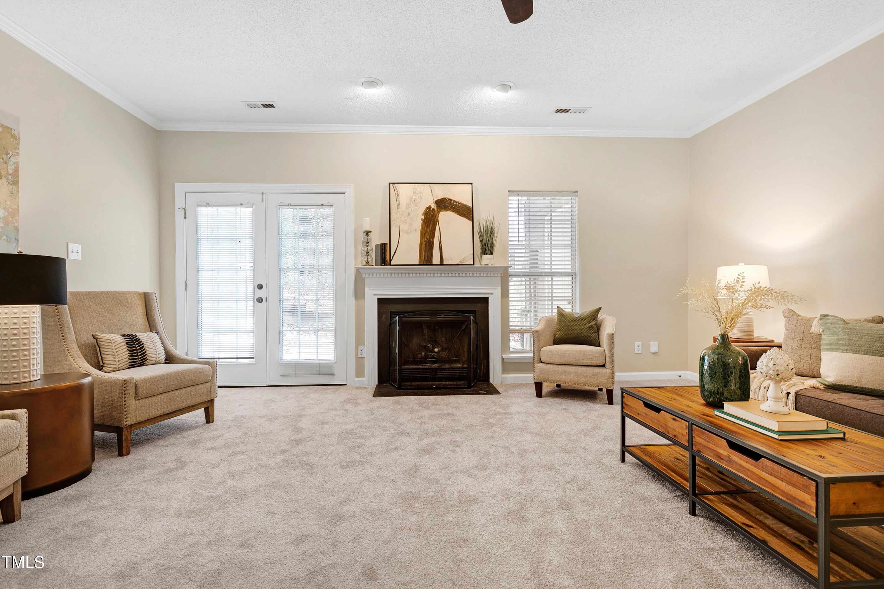 4414 Still Pines Drive Raleigh, NC 27613 - Photo 16 of 36 a living room with furniture and a fireplace