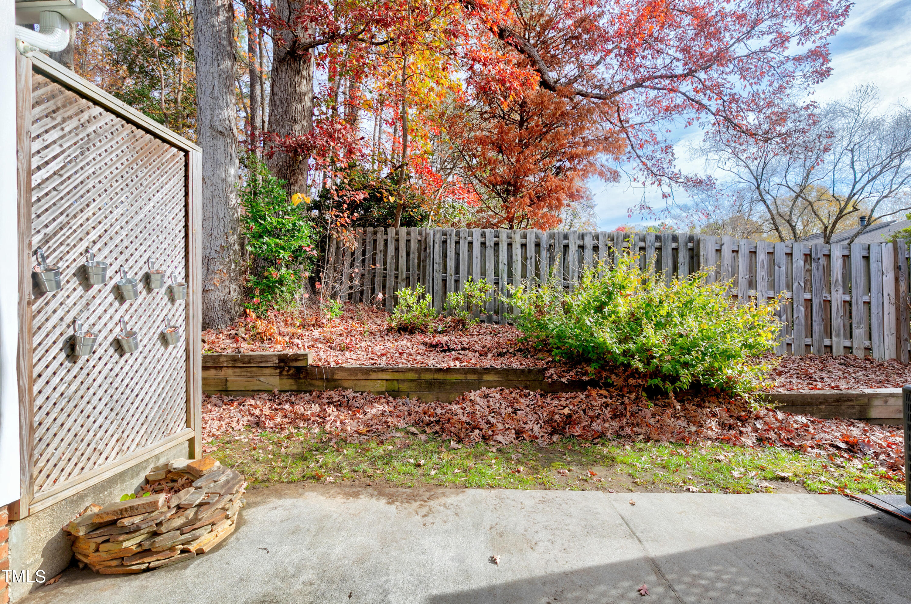 4414 Still Pines Drive Raleigh, NC 27613 - Photo 34 of 36 a backyard of a house with lots of green space