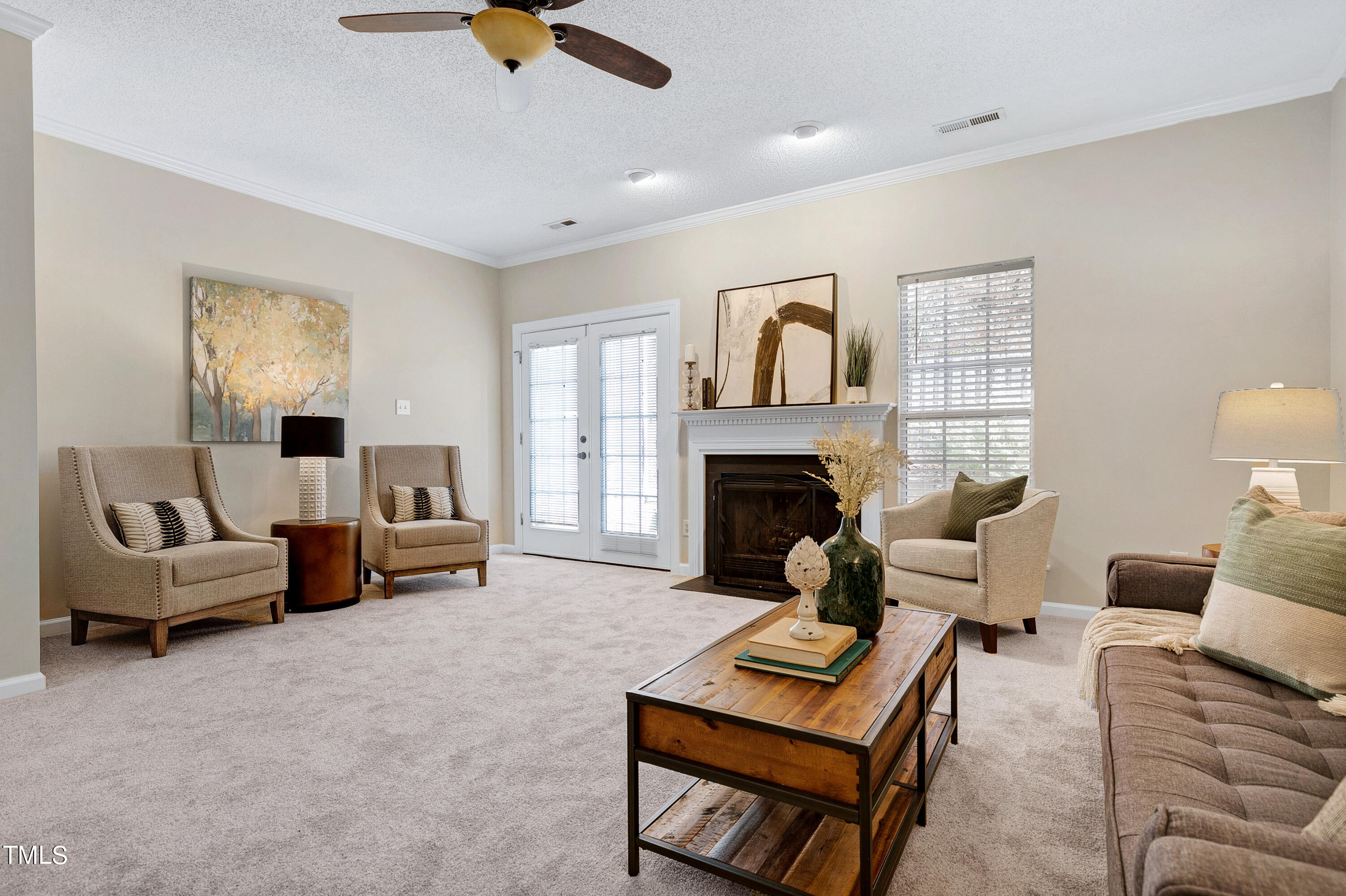4414 Still Pines Drive Raleigh, NC 27613 - Photo 6 of 36 a living room with furniture and a fireplace