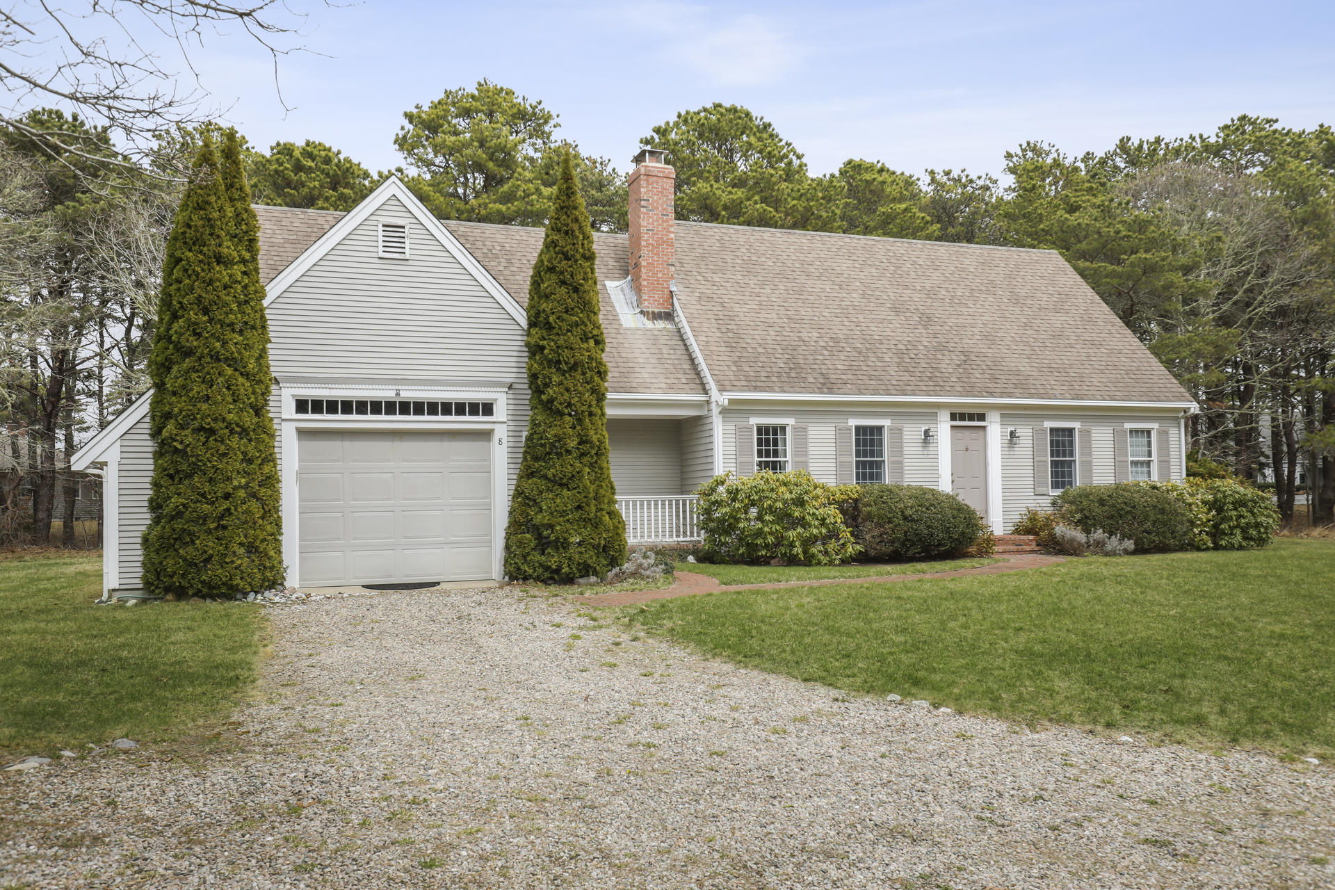a view of a house with yard and a garden