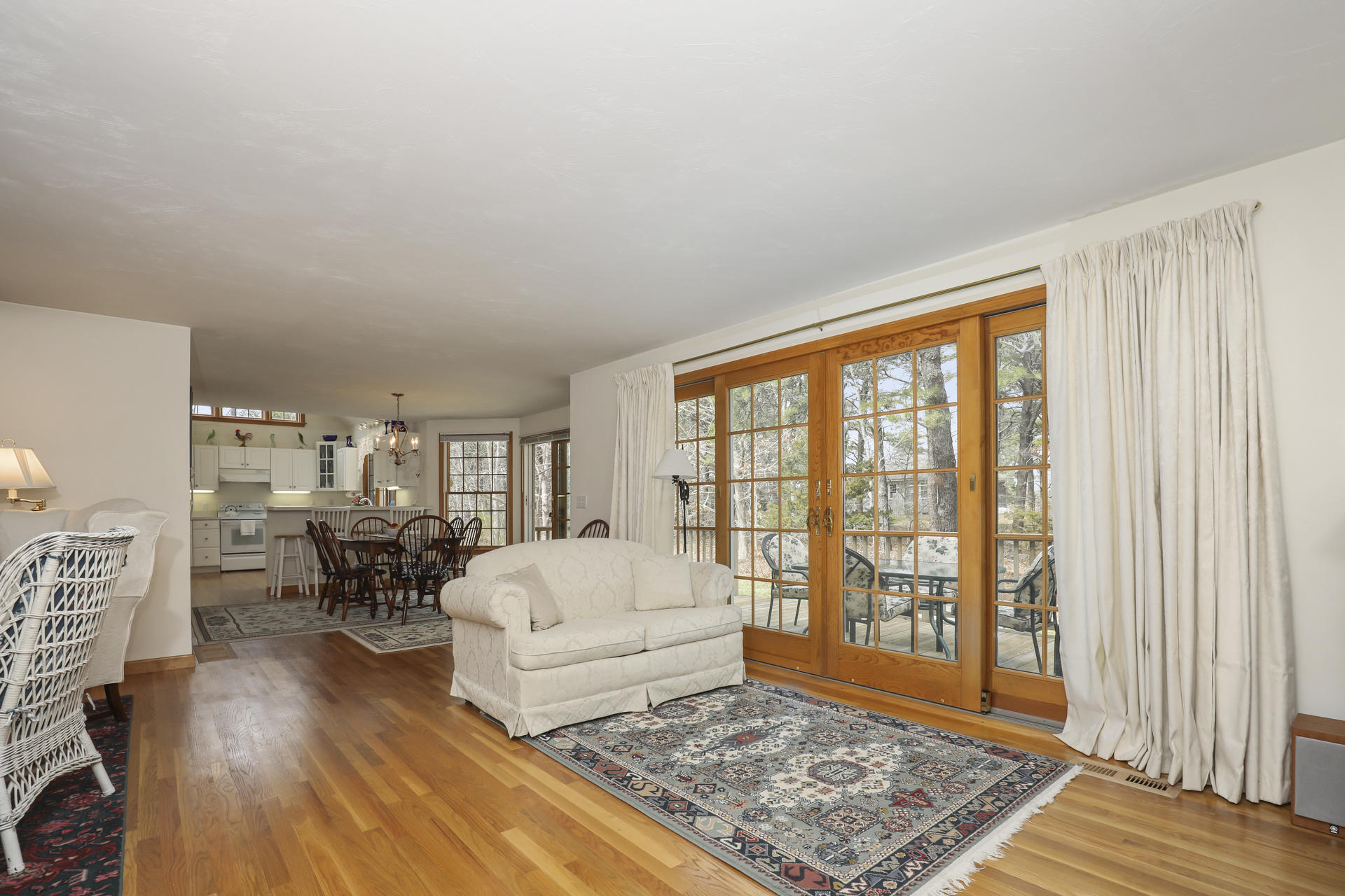 8 Clark's Point Road Eastham, MA 02642 - Photo 12 of 35 a living room with furniture and a rug