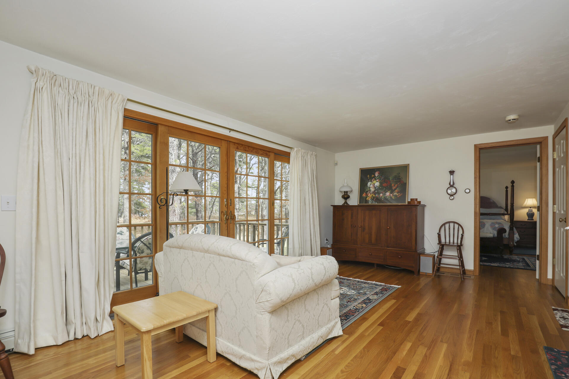 8 Clark's Point Road Eastham, MA 02642 - Photo 13 of 35 a living room with furniture and a large window