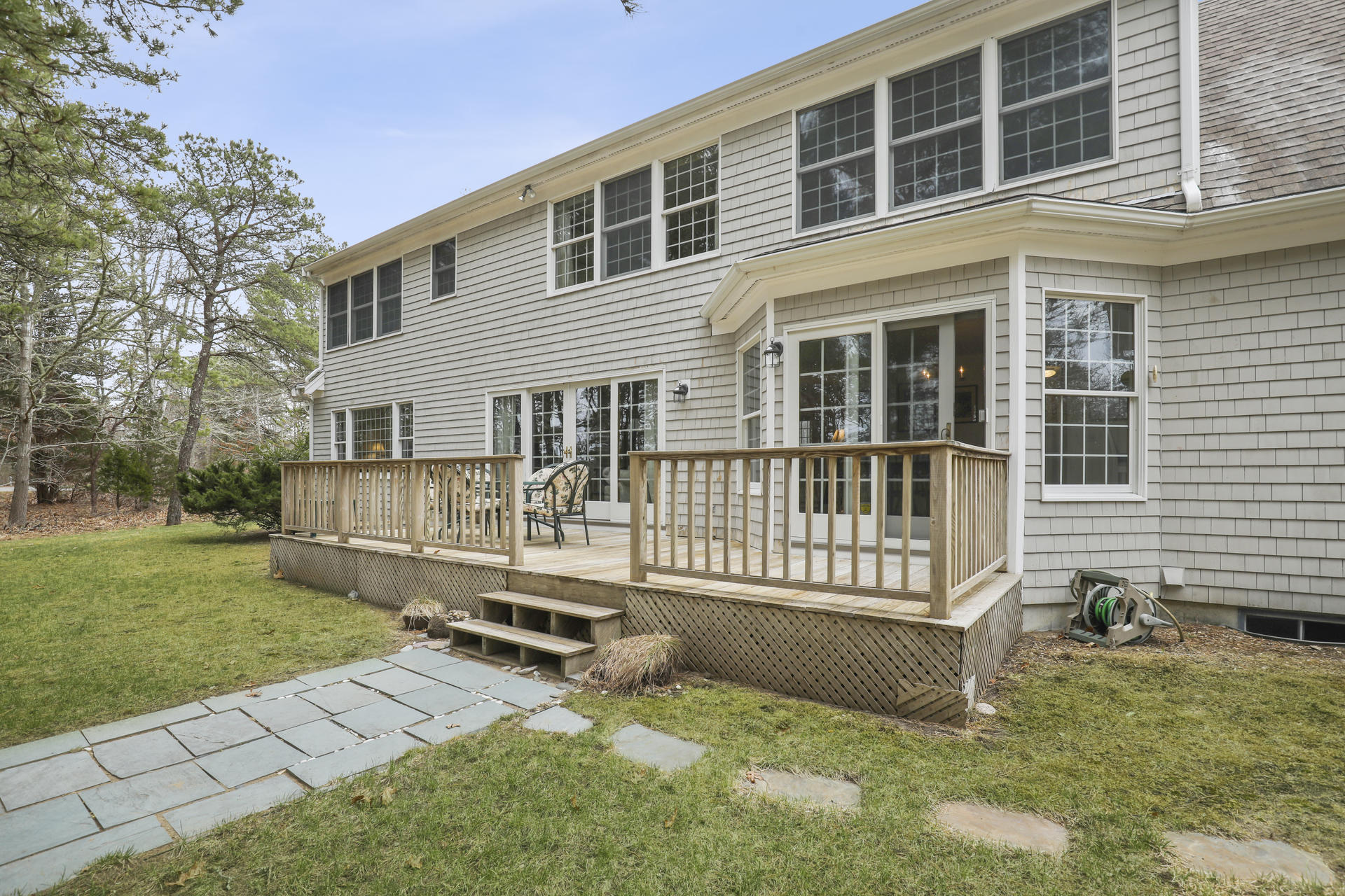 8 Clark's Point Road Eastham, MA 02642 - Photo 22 of 35 a view of a house with backyard and sitting area