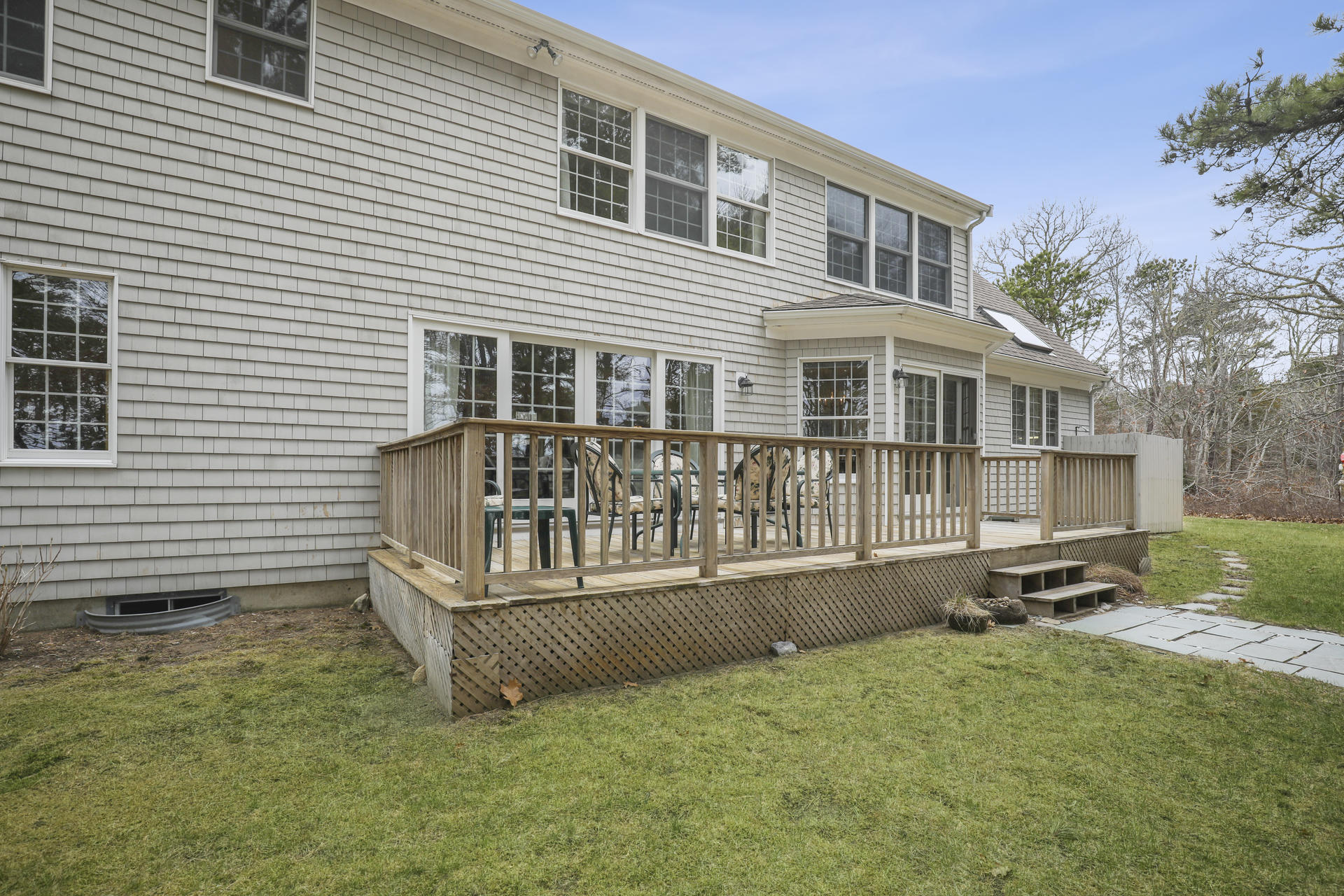 8 Clark's Point Road Eastham, MA 02642 - Photo 23 of 35 a view of a house with backyard and sitting area