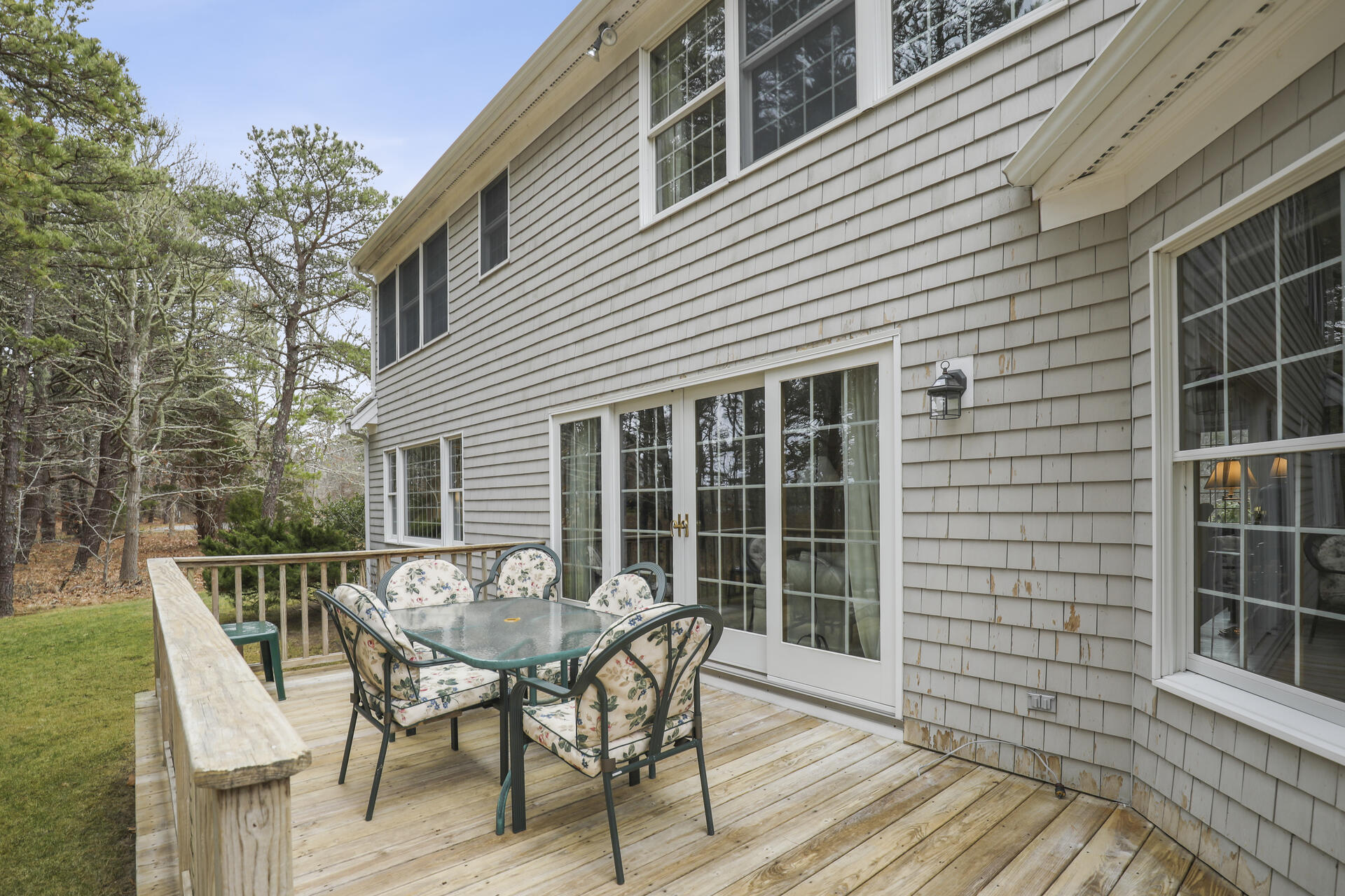 8 Clark's Point Road Eastham, MA 02642 - Photo 24 of 35 a view of deck with table and chairs and wooden floor