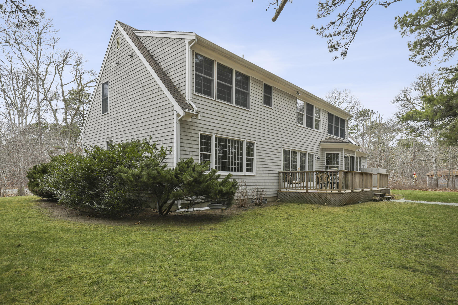 8 Clark's Point Road Eastham, MA 02642 - Photo 26 of 35 a front view of a house with a garden and plants