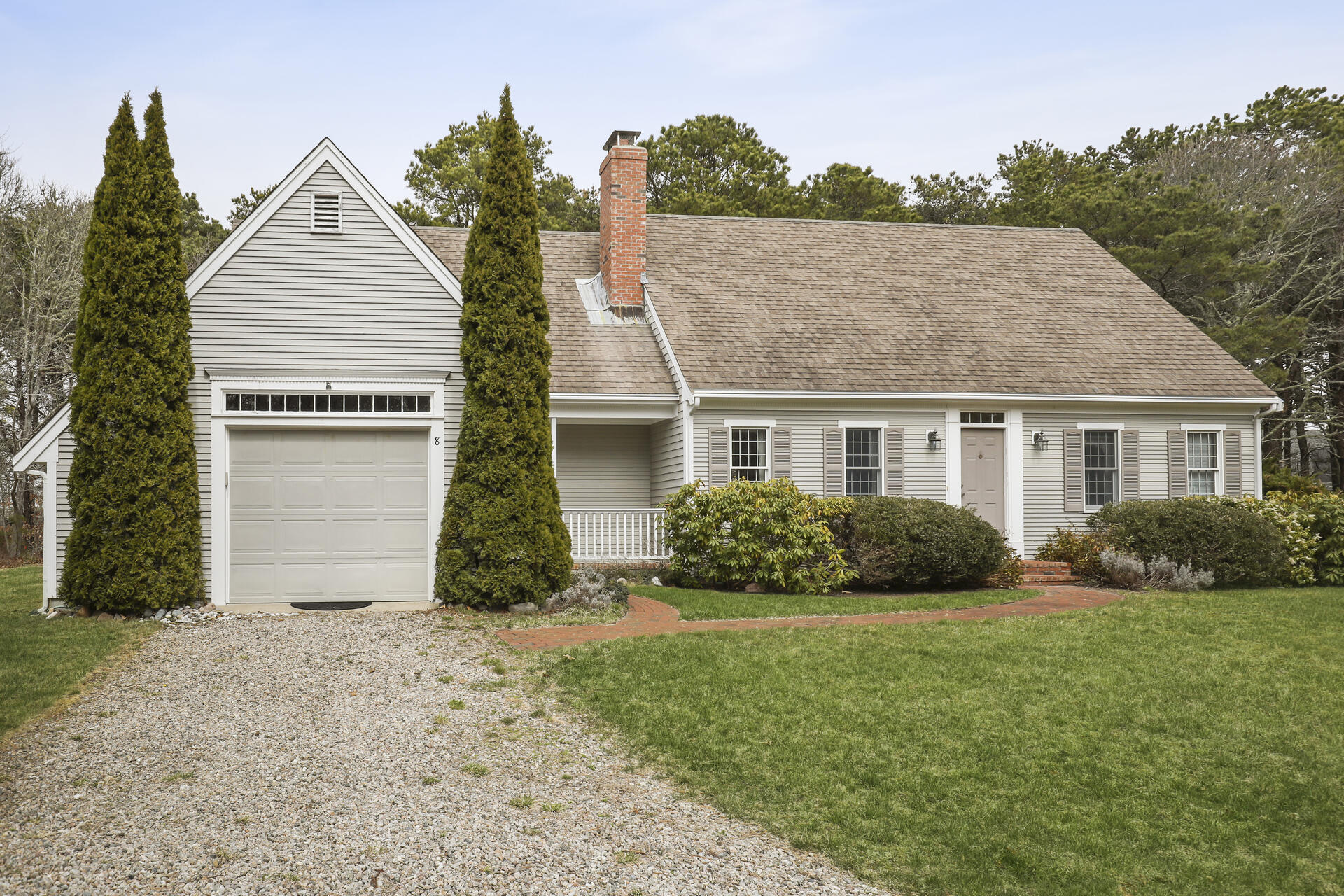 8 Clark's Point Road Eastham, MA 02642 - Photo 33 of 35 a front view of a house with a yard and garage