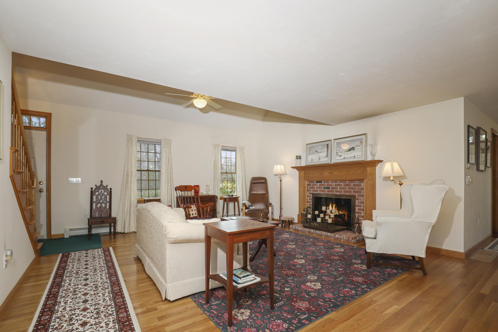 8 Clark's Point Road Eastham, MA 02642 - Photo 8 of 35 a living room with furniture and a fireplace