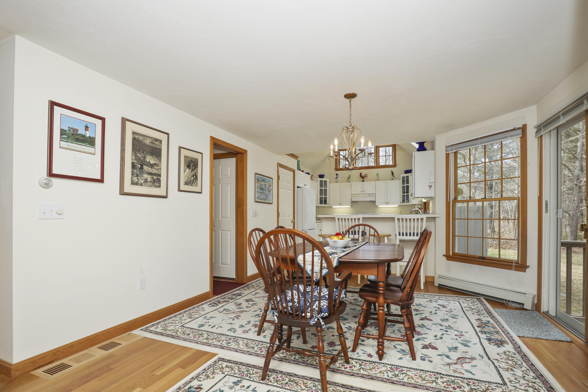 8 Clark's Point Road Eastham, MA 02642 - Photo 9 of 35 a view of a dining room with furniture window and wooden floor