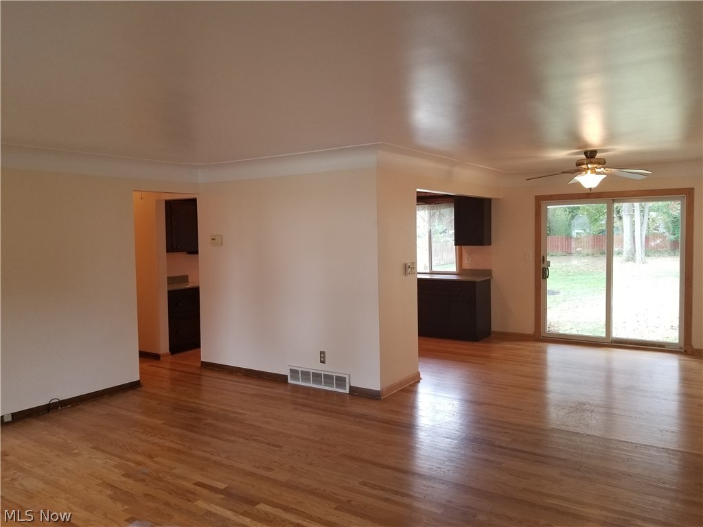 1915 Lorimer Road Cleveland, OH 44134 - Photo 2 of 29 Living room/Dining room with beautiful cove ceiling and gleaming wood floor