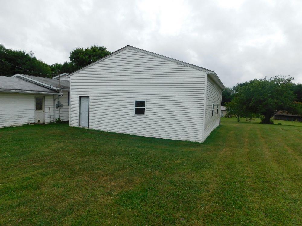 443 Fairview Road Fredonia, PA 16124 - Photo 11 of 12 a view of a backyard with plants and a garden