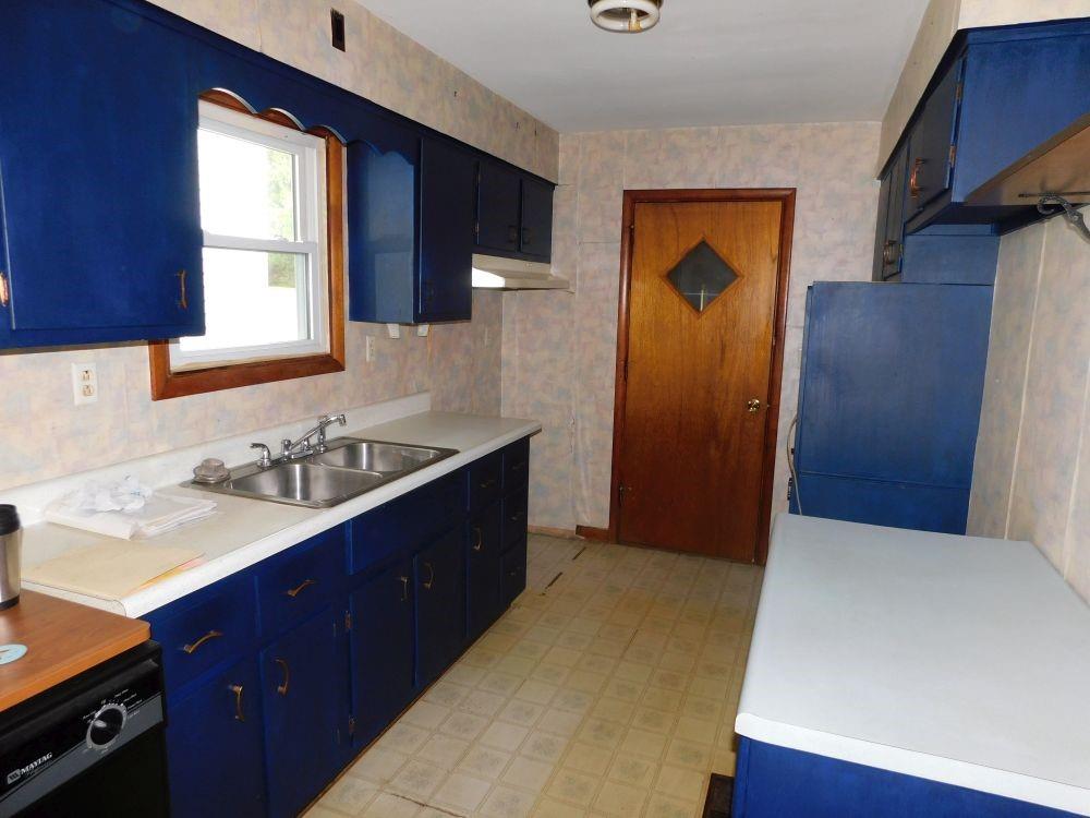 443 Fairview Road Fredonia, PA 16124 - Photo 2 of 12 a kitchen with a sink and a refrigerator