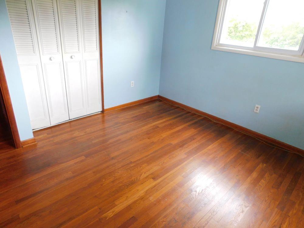 443 Fairview Road Fredonia, PA 16124 - Photo 6 of 12 an empty room with wooden floor and windows