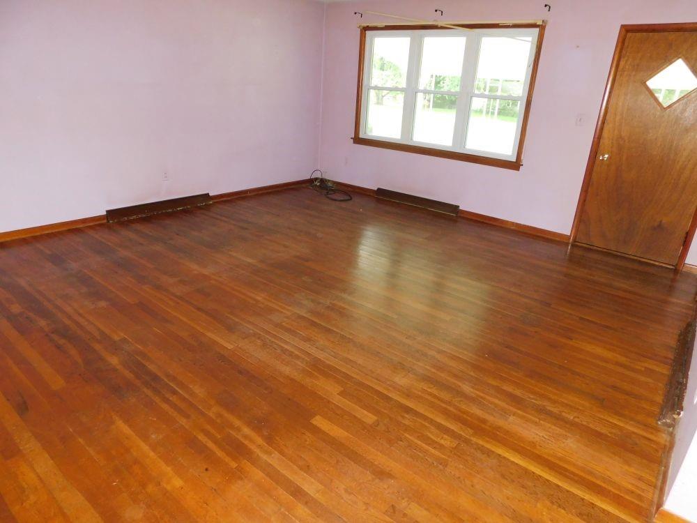 443 Fairview Road Fredonia, PA 16124 - Photo 7 of 12 an empty room with wooden floor and windows