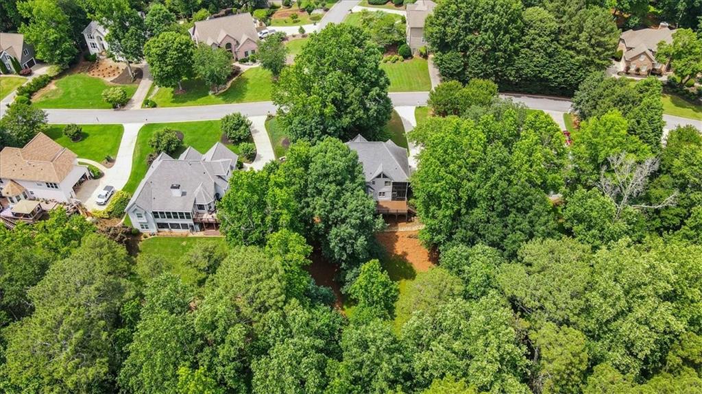 1710 Rising Mist Lane Cumming, GA 30041 - Photo 90 of 111 an aerial view of residential house with outdoor space and trees all around