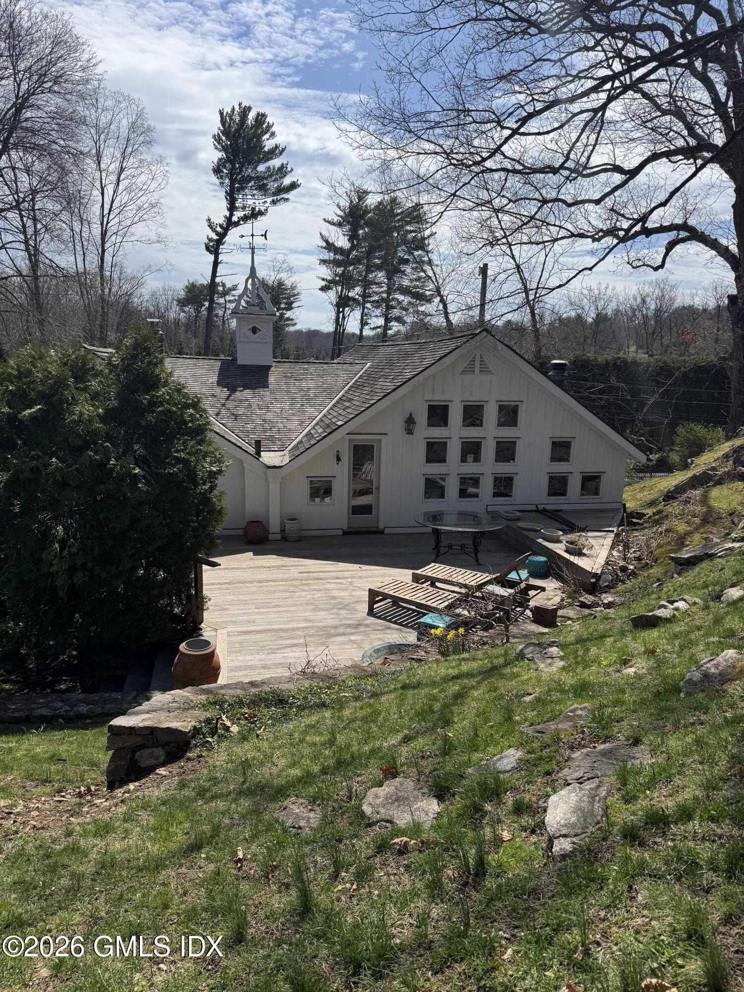 332 Riversville Road Greenwich, CT 06831 - Photo 11 of 22 a front view of a house with garden