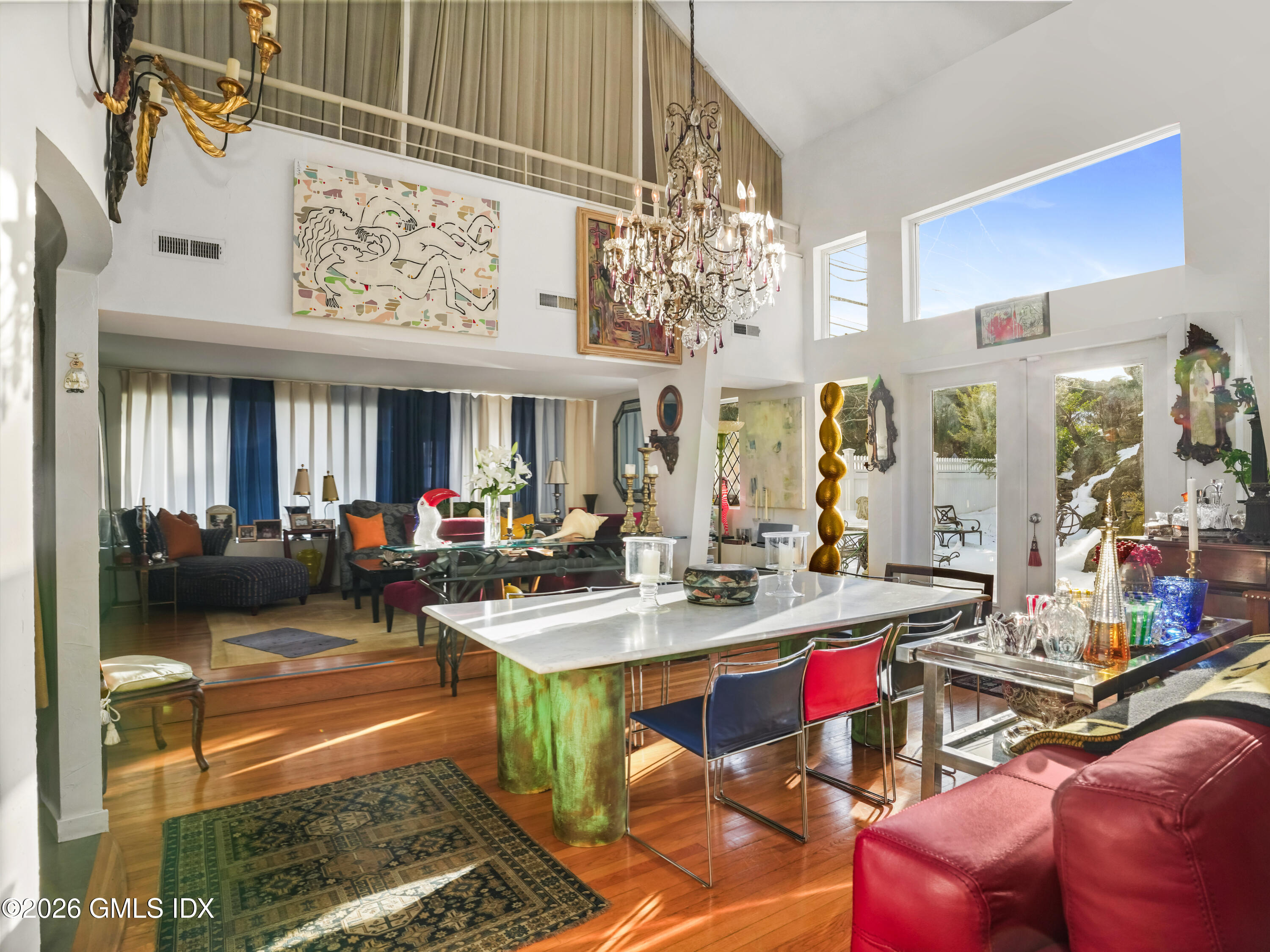 332 Riversville Road Greenwich, CT 06831 - Photo 14 of 22 a view of a dining room with furniture a rug and a chandelier