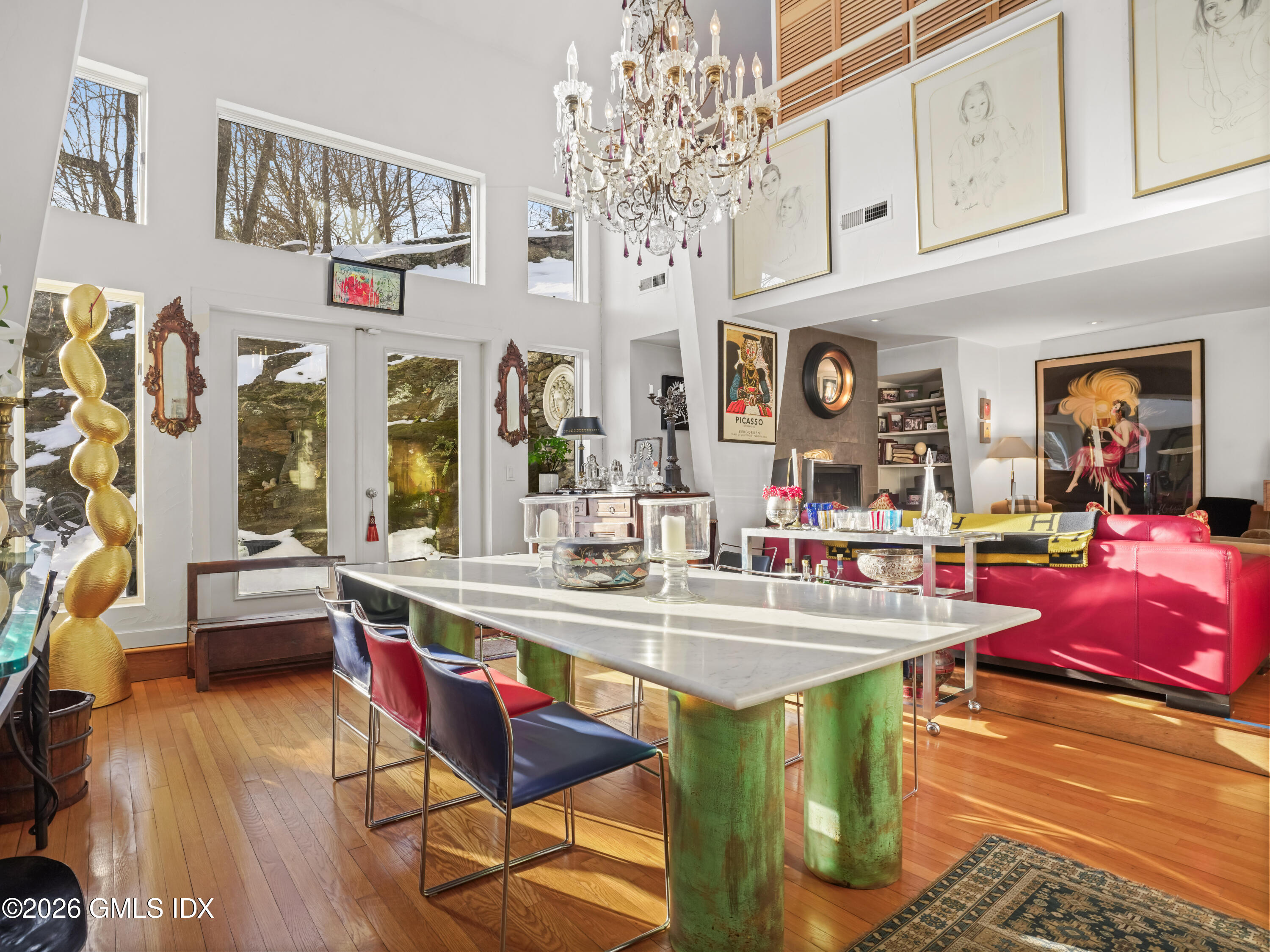 332 Riversville Road Greenwich, CT 06831 - Photo 15 of 22 a view of a dining room with furniture a chandelier and wooden floor