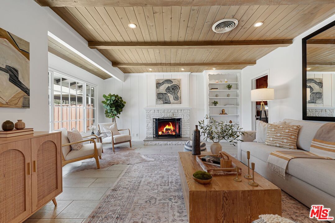 5350 Fallbrook Avenue Woodland Hills, CA 91367 - Photo 1 of 25 a living room with furniture and a fireplace