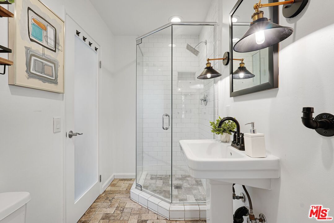 5350 Fallbrook Avenue Woodland Hills, CA 91367 - Photo 12 of 25 a bathroom with a sink and mirror