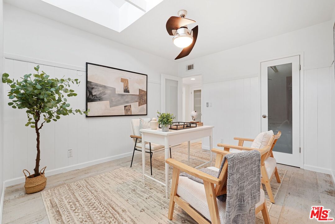 5350 Fallbrook Avenue Woodland Hills, CA 91367 - Photo 13 of 25 a living room with furniture and a potted plant