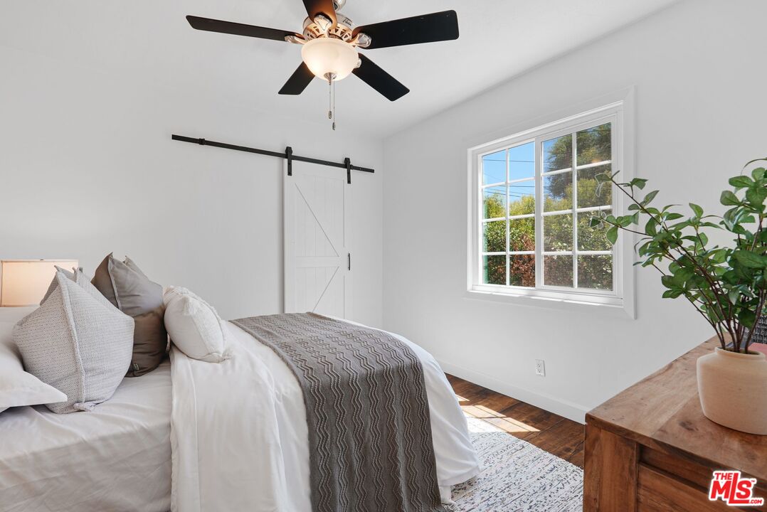 5350 Fallbrook Avenue Woodland Hills, CA 91367 - Photo 15 of 25 a bedroom with a bed and a window