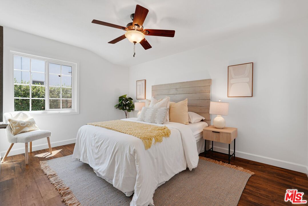 5350 Fallbrook Avenue Woodland Hills, CA 91367 - Photo 18 of 25 a bedroom with a bed and a window