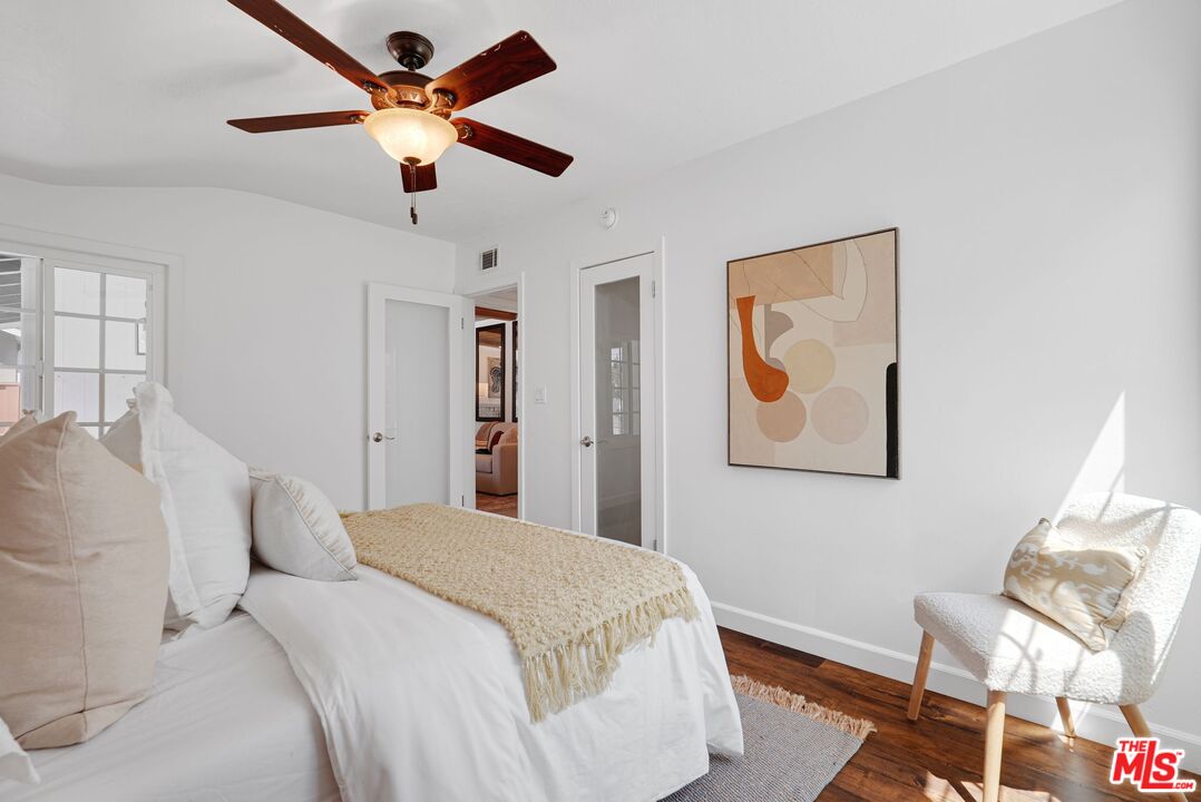 5350 Fallbrook Avenue Woodland Hills, CA 91367 - Photo 19 of 25 a bedroom with a bed and a painting on the wall