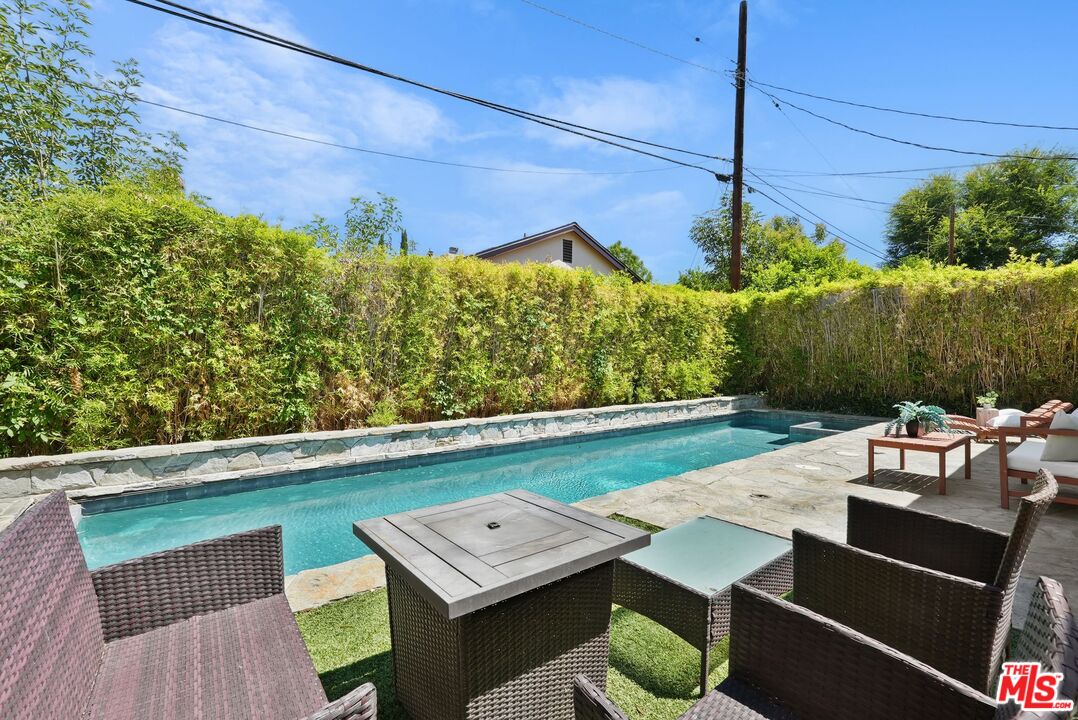 5350 Fallbrook Avenue Woodland Hills, CA 91367 - Photo 20 of 25 a view of a patio with table and chairs potted plants
