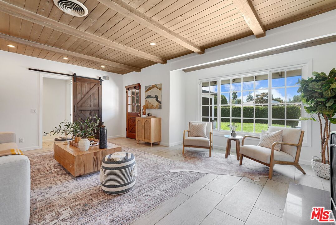 5350 Fallbrook Avenue Woodland Hills, CA 91367 - Photo 3 of 25 a living room with furniture and a potted plant