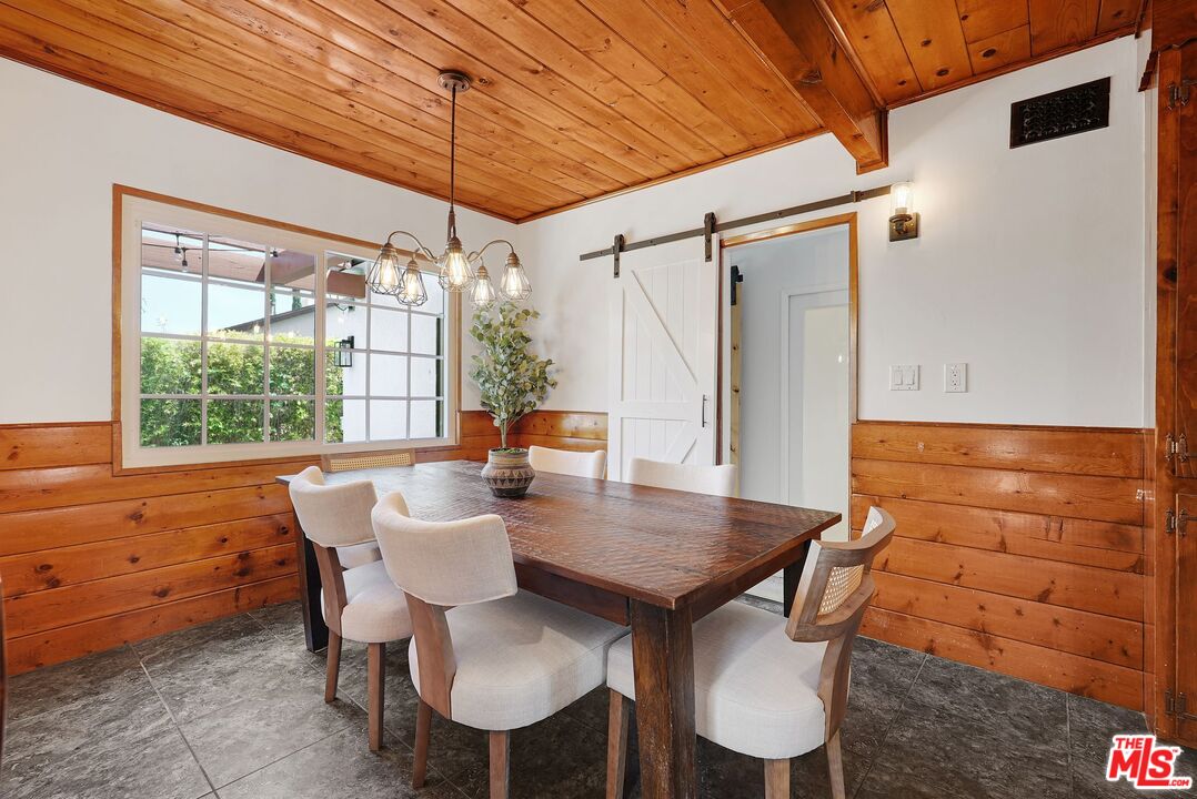 5350 Fallbrook Avenue Woodland Hills, CA 91367 - Photo 8 of 25 a view of a dining room with furniture window and outside view