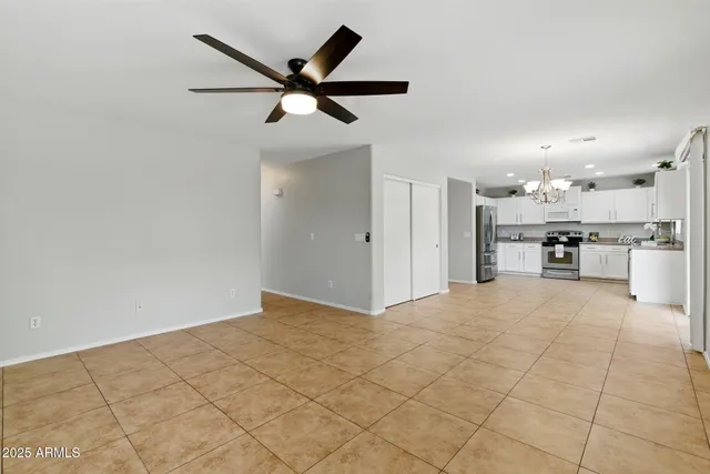 a view of a kitchen with a sink and a refrigerator