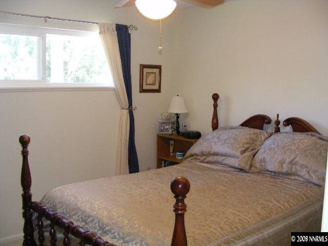 1270 Rayburn Drive Reno, NV 89503 - Photo 5 of 9 a bedroom with a bed and a window