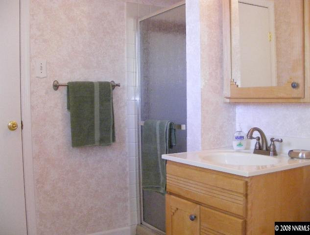 1270 Rayburn Drive Reno, NV 89503 - Photo 6 of 9 a bathroom with a sink and a mirror