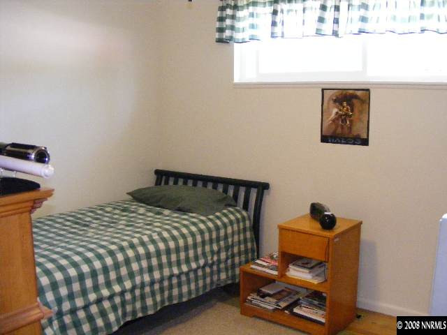 1270 Rayburn Drive Reno, NV 89503 - Photo 7 of 9 a bedroom with a bed and a window