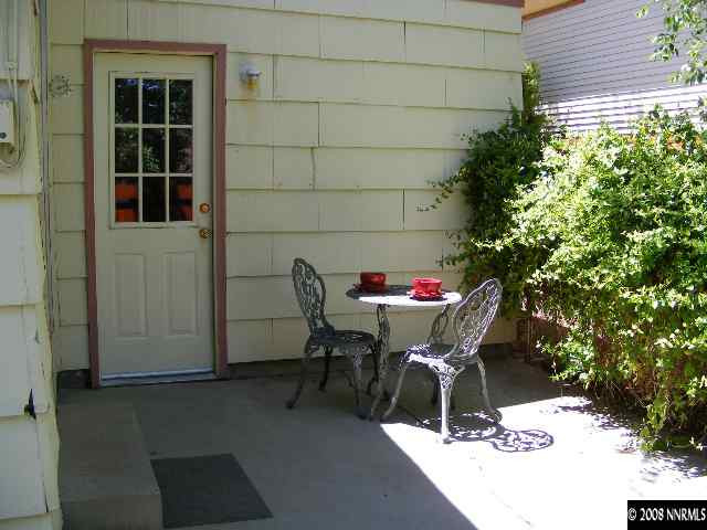 1270 Rayburn Drive Reno, NV 89503 - Photo 8 of 9 a outdoor dining space with furniture and a potted plant