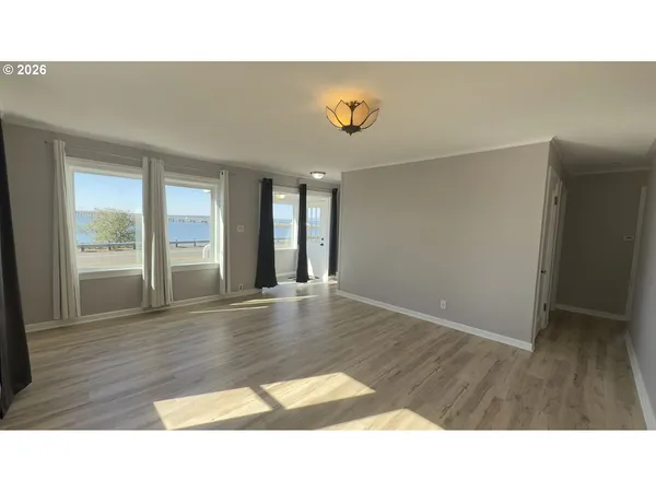 a room with a bed and a window