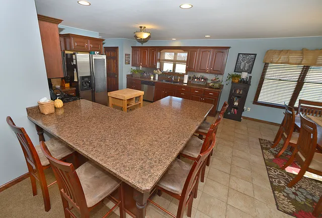 a dining room with furniture and window