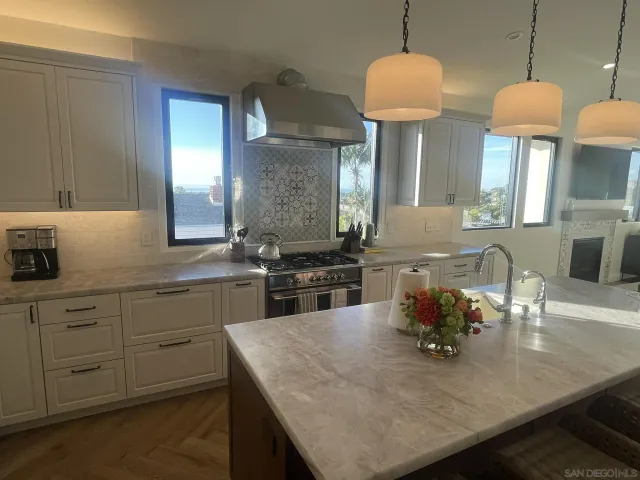 a kitchen with sink and a wooden cabinets