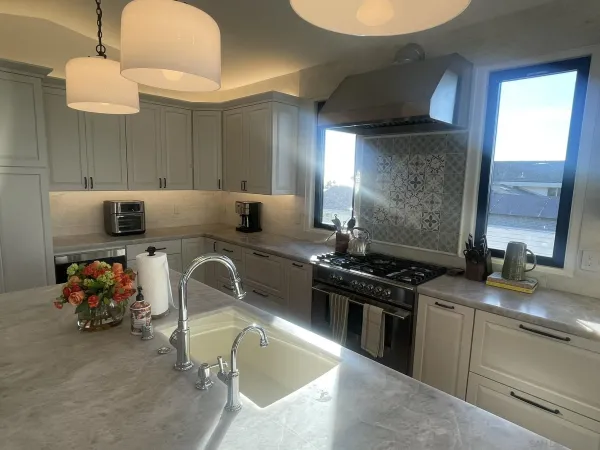 a kitchen that has a sink and a stove