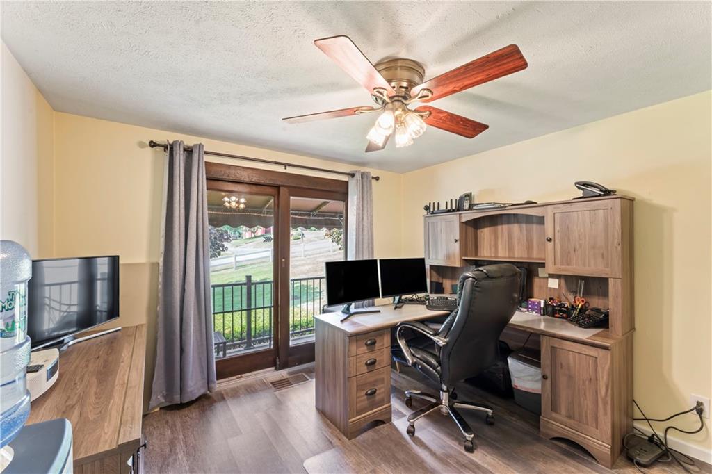 19 Ellen Drive McKees Rocks, PA 15136 - Photo 12 of 38 a view of a workspace with furniture and a flat screen tv